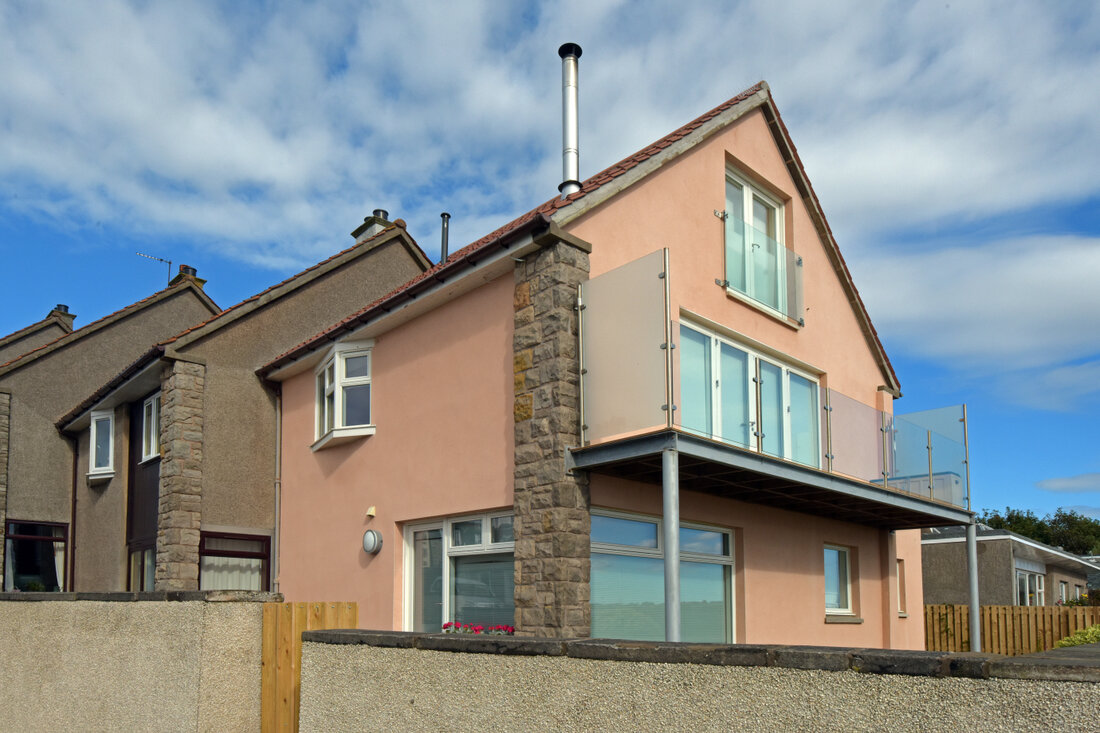 Semi-detached home with new roughcast finish