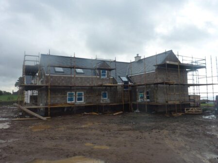 Roofing team working on a tiled roof